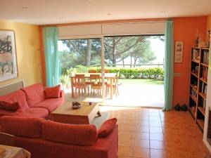 Large living area with big windows leading on to patio, garden and those views