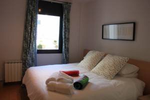 The second bedroom configured with a large double bed
